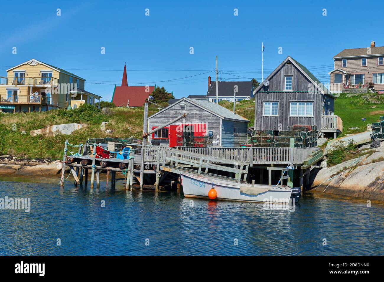 CANADA, NOVA SCOTIA,PEGGY'S COVE. Waterfront of the fishing Village Peggy's Cove with boat and wooden houses in Nova Scotia Stock Photo
