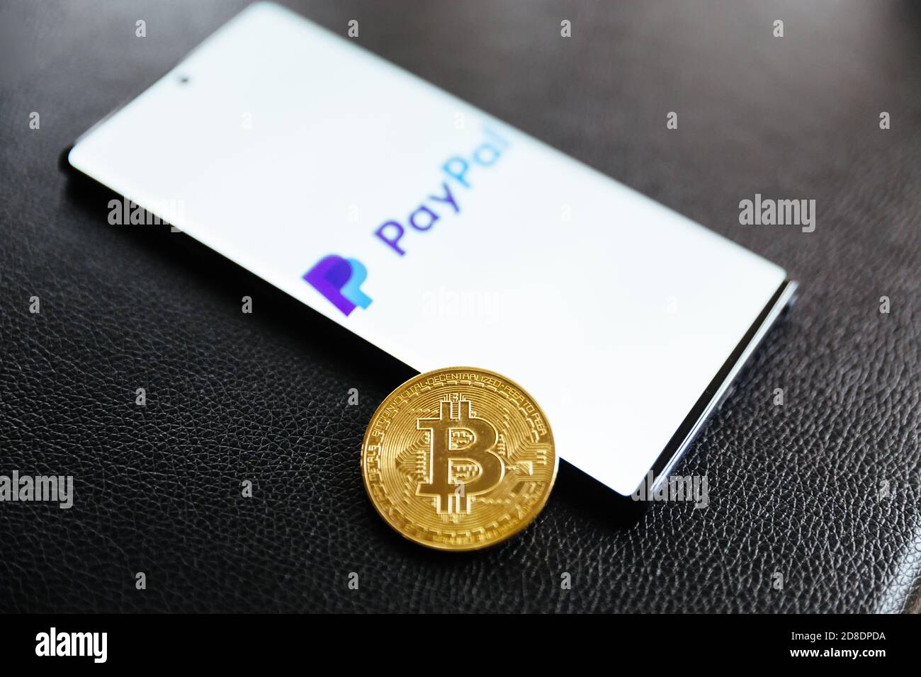 Zagreb, Croatia – October 29 2020 - PayPal logo on the smartphone screen with bitcoin cryptocurrency. Paypal is an internet based digital money transf Stock Photo