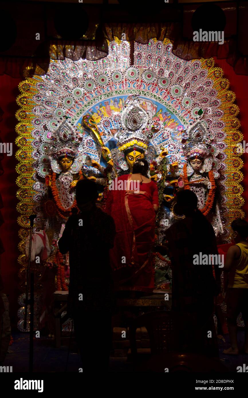 Durga Boron is a long process, in which ladies offer sweets, sindur and other items to the idol. Stock Photo