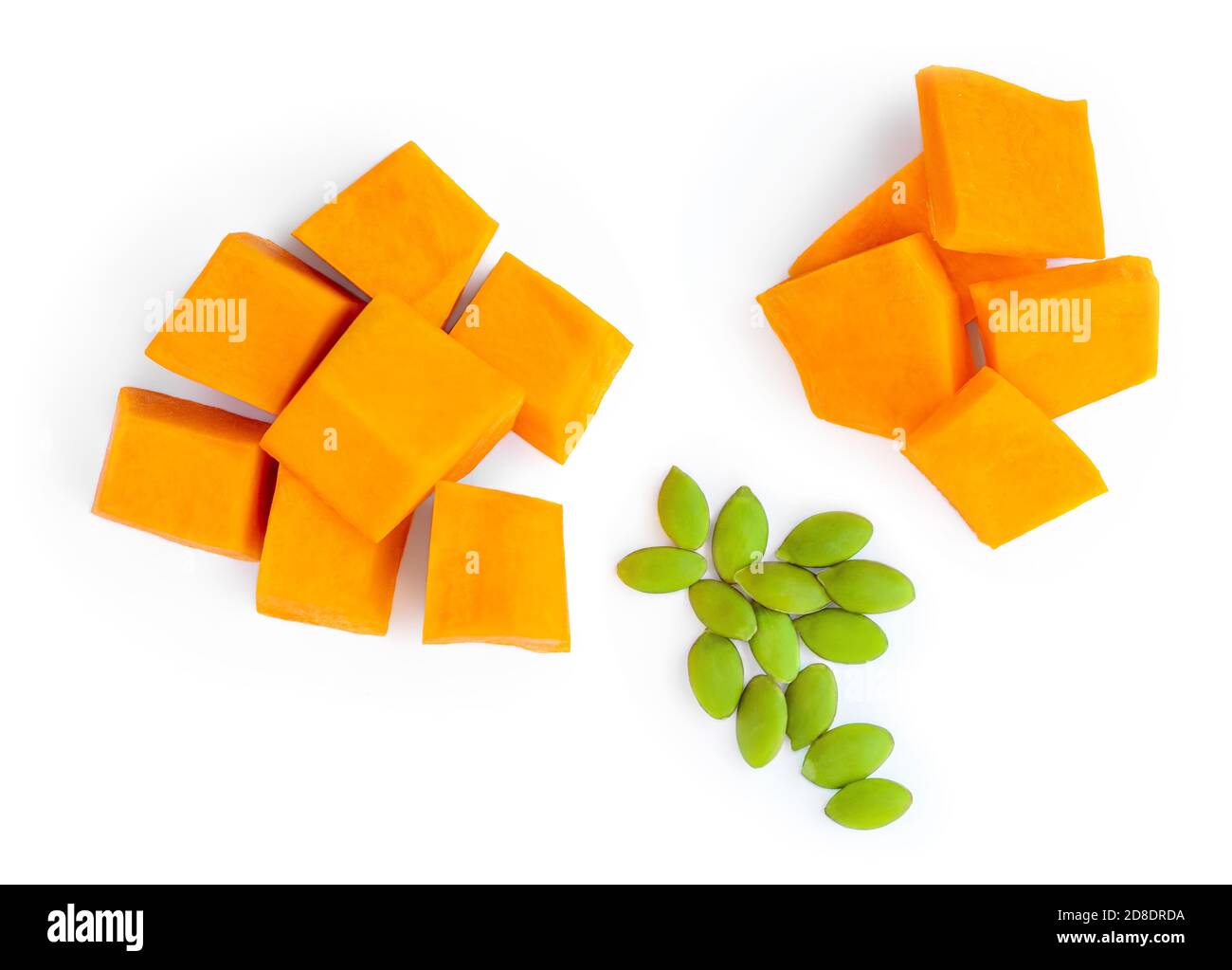 Pumpkin pieces cut in a cube slices isolated on white background. Diced Pumpkin, close up. Top view Stock Photo