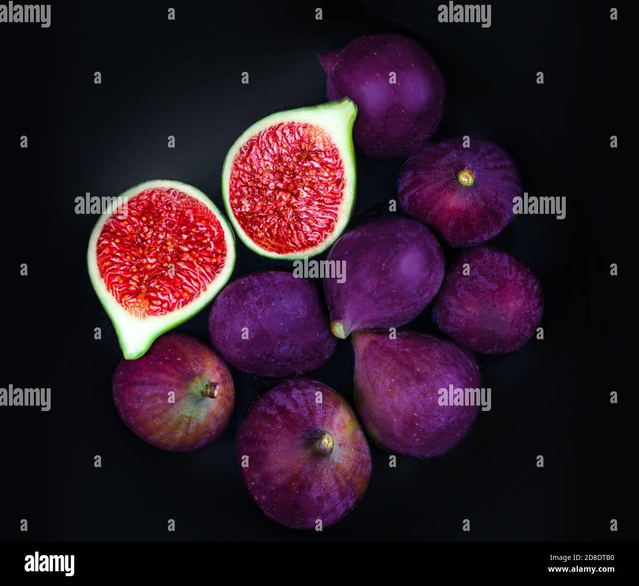 Fresh ripe figs with on table black background. Dark Food photo Stock Photo