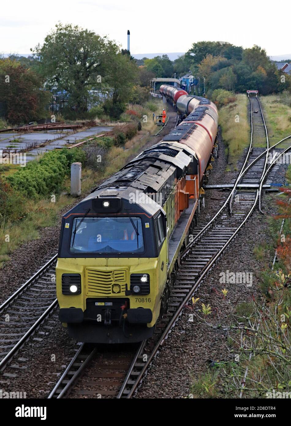 Colas diesel locomotive 70816 is shunting oil tankers for the unloading depot that is next to the station at Dalston near Carlisle 9.10.2020. Stock Photo