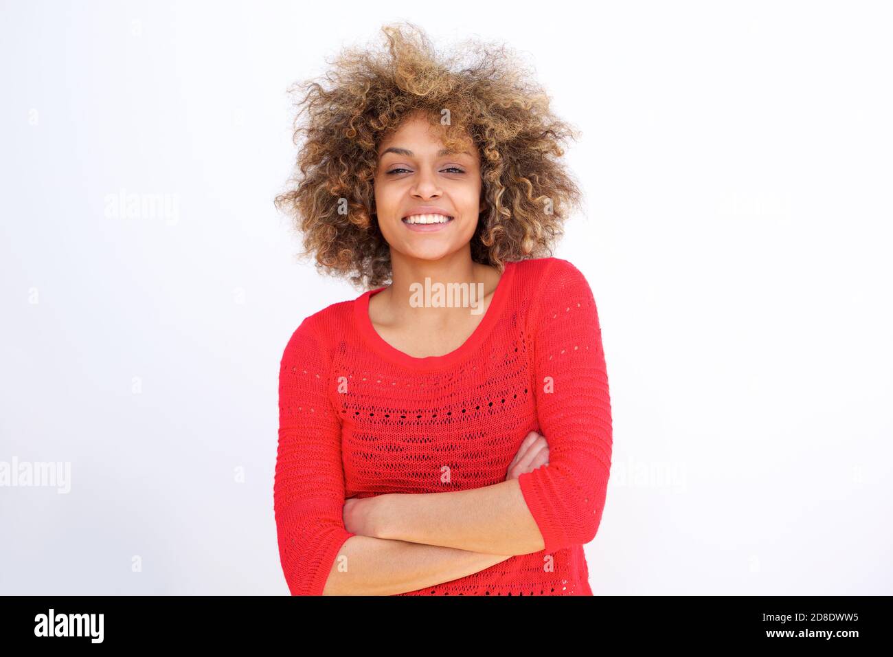 Portrait of confident young black woman smiling with arms crossed Stock ...