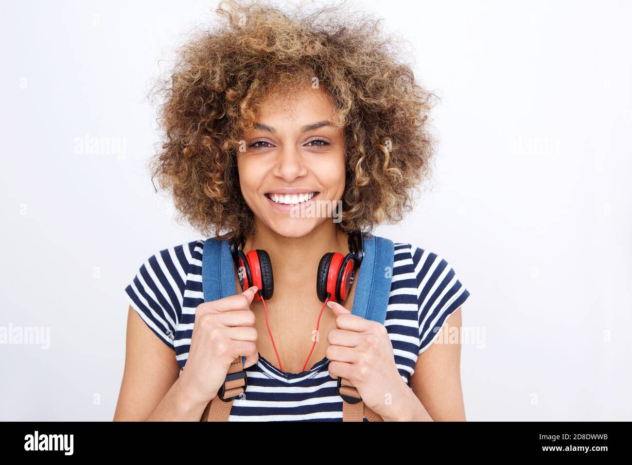 Front portrait of young smiling black woman against white wall Stock ...