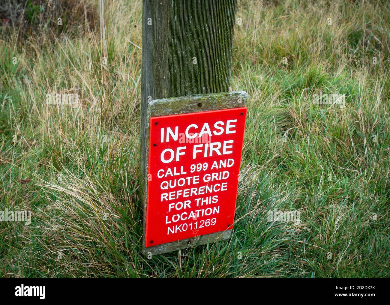Countryside fire location sign in Scotland, giving grid reference for location Stock Photo