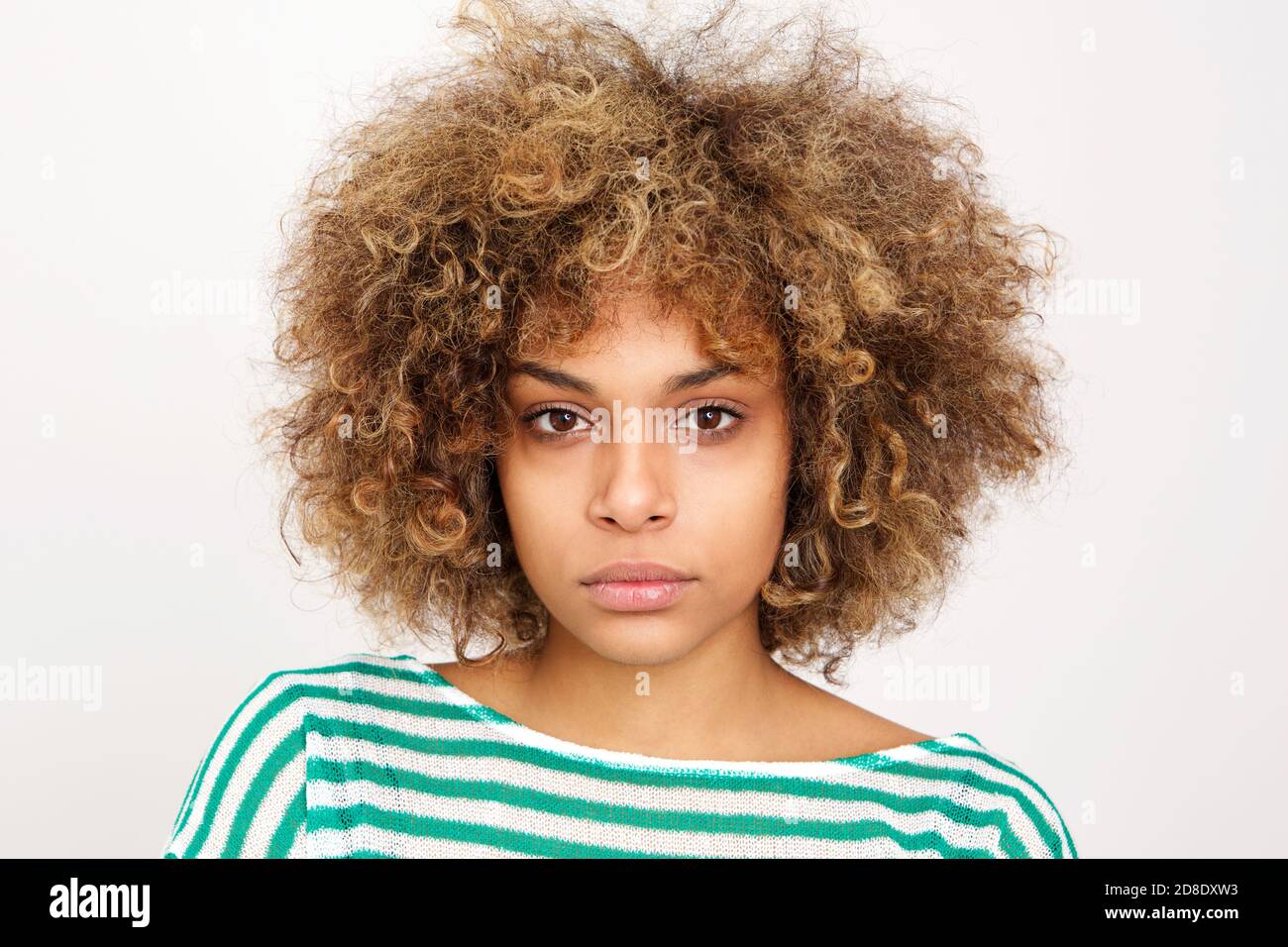 Close up portrait of serious young african american woman against white ...