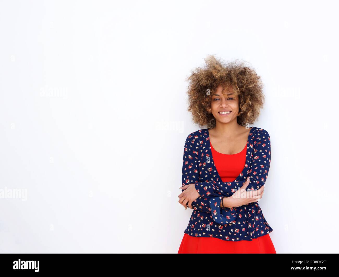 Portrait of beautiful african american girl with curly hair standing ...