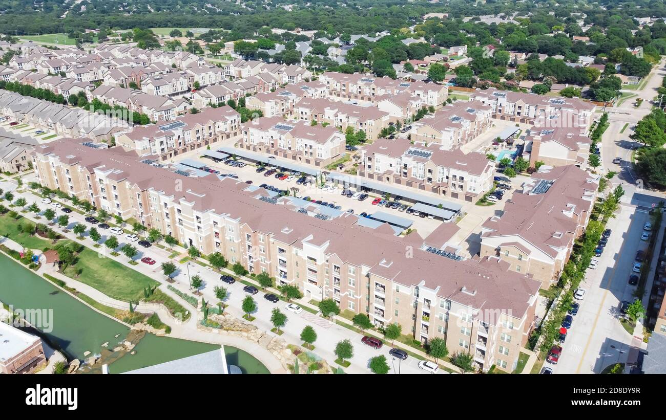 Flyover multistory apartment complex and suburban residential area in
