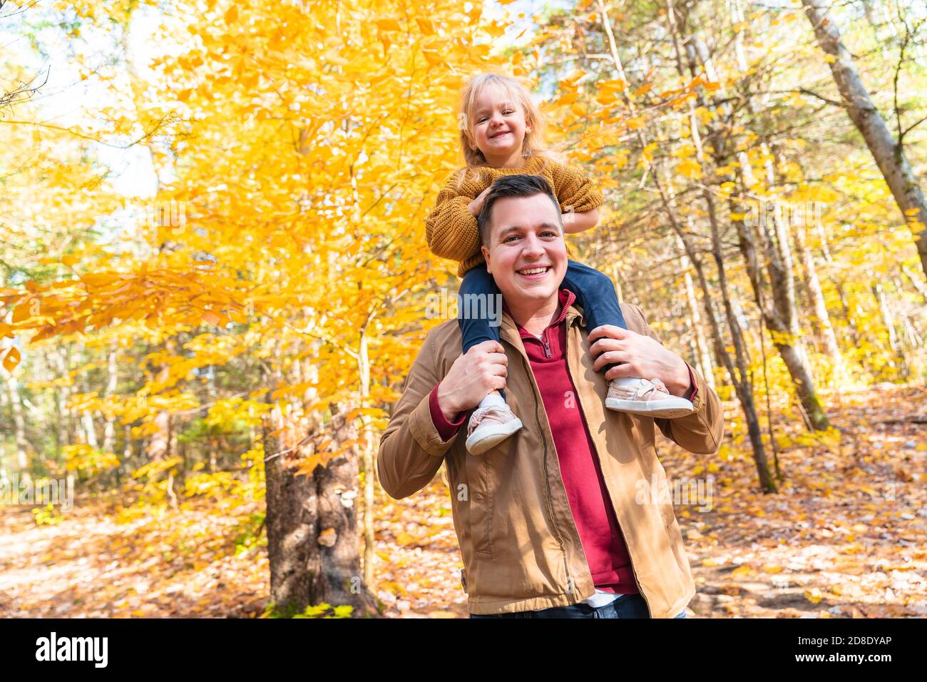 daughter and her father in the autumn season in park Stock Photo - Alamy