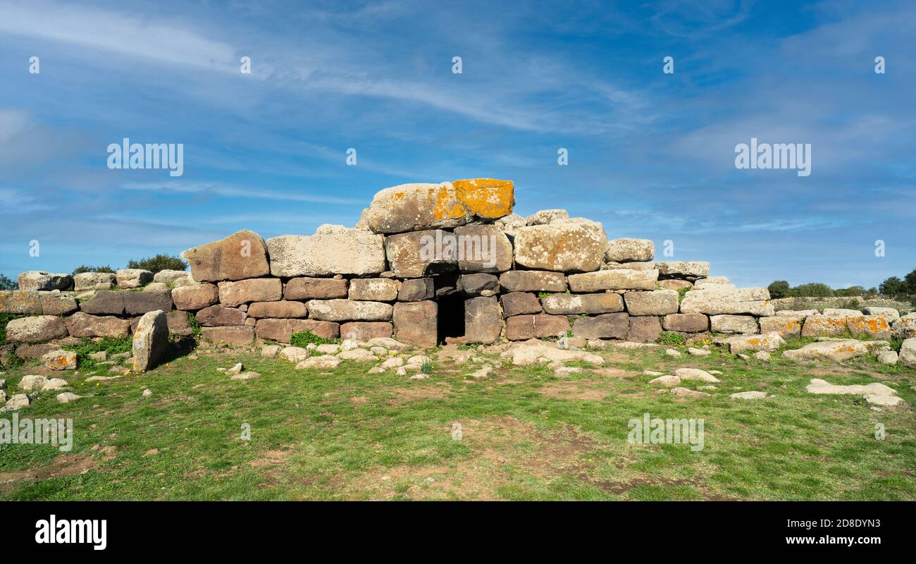 Archeological ruins of Nuragic necropolis Giants Tomb of S’omu de S’orcu - Tomba di Giganti Omu de Orcu - with front grave stones of Neolithic cemeter Stock Photo