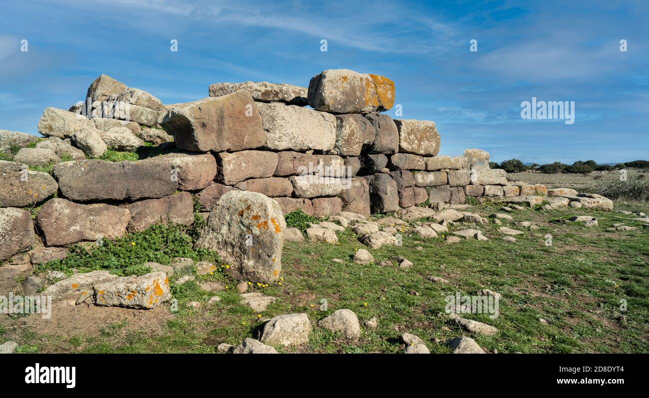 Archeological ruins of Nuragic necropolis Giants Tomb of S’omu de S’orcu - Tomba di Giganti Omu de Orcu - with front grave stones of Neolithic cemeter Stock Photo
