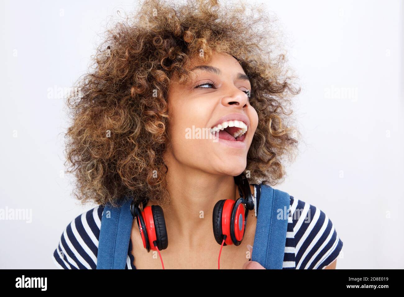 Close up portrait of beautiful young african american woman laughing ...