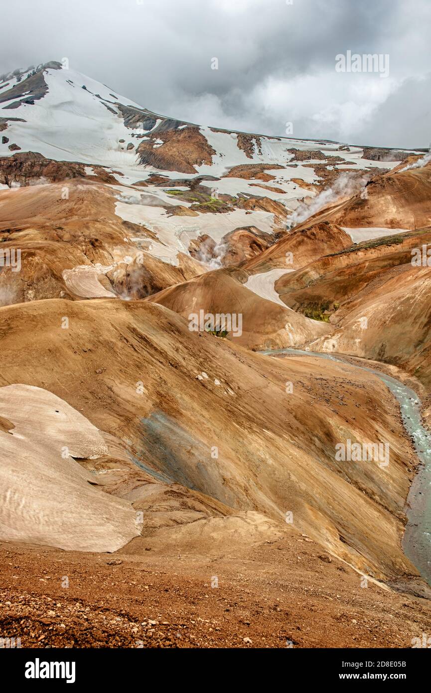 Iceland is a land of ice and fire. In the geothermal area Kerlingarfjoll one can see smoke and boiling fumaroles from the geothermal field as well as Stock Photo