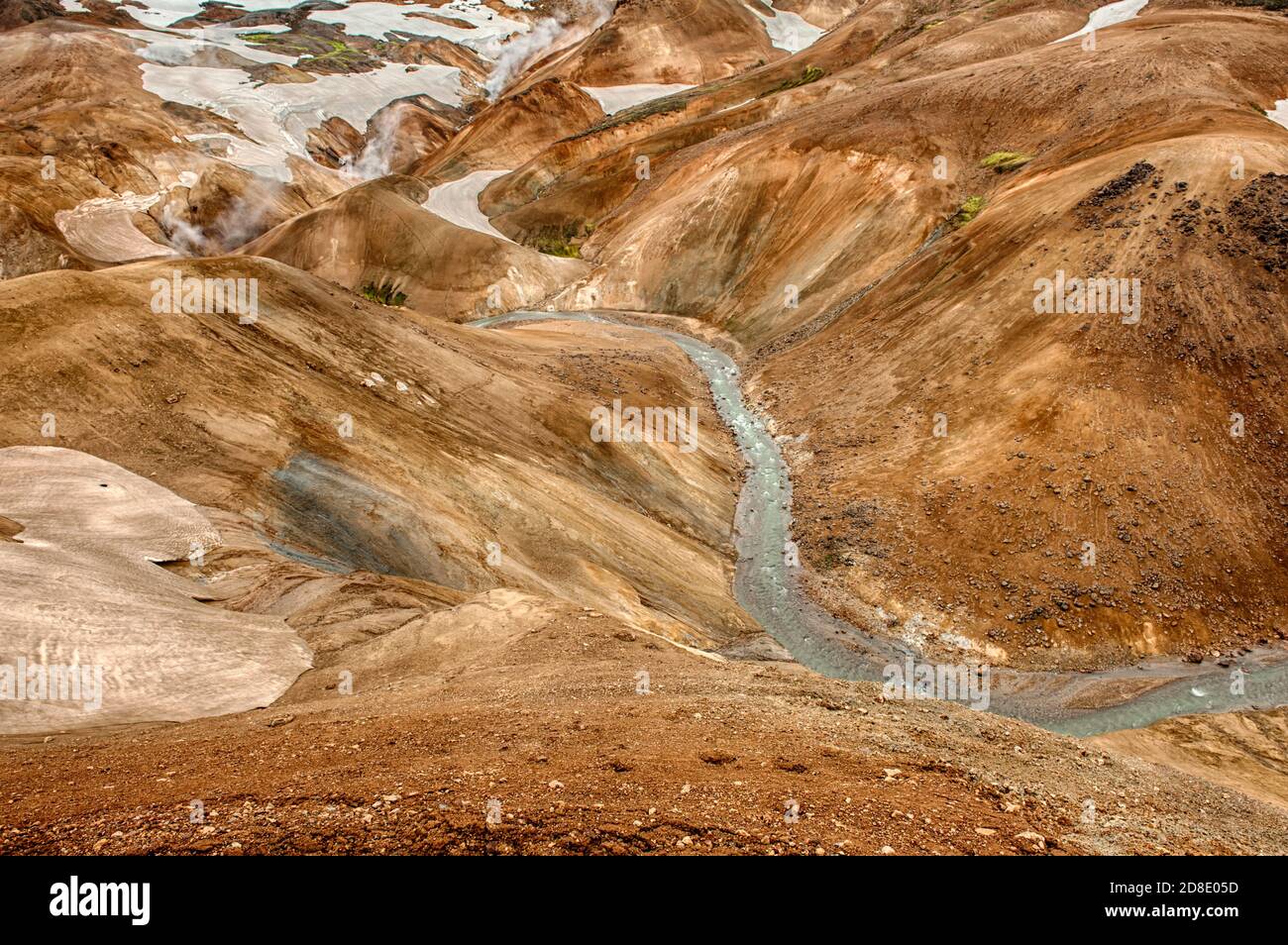 Iceland is a land of ice and fire. In the geothermal area Kerlingarfjoll one can see smoke and boiling fumaroles from the geothermal field as well as Stock Photo