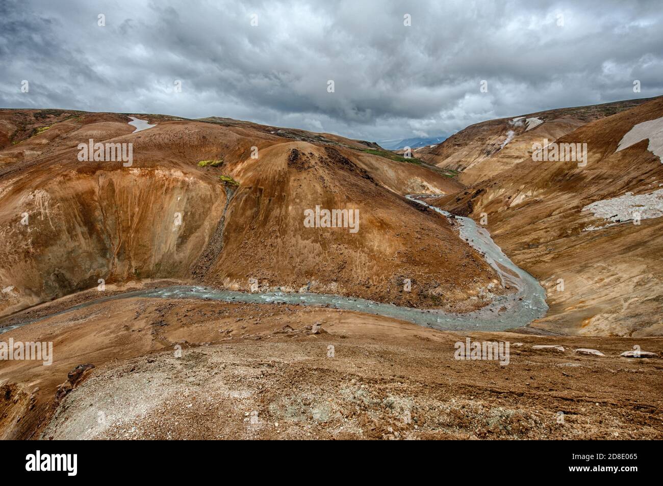 Iceland is a land of ice and fire. In the geothermal area Kerlingarfjoll one can see smoke and boiling fumaroles from the geothermal field as well as Stock Photo