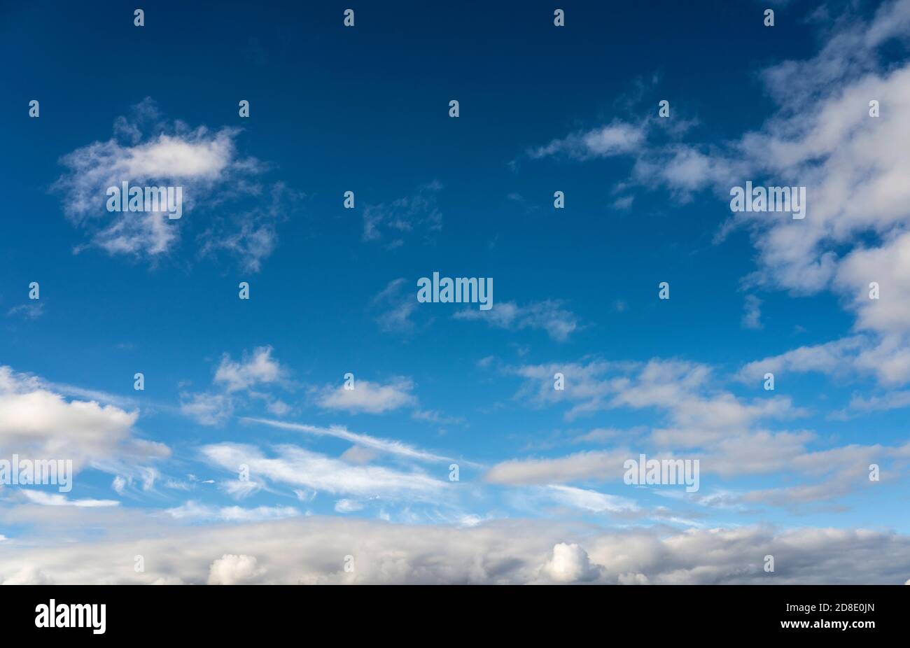 Alto cumulus clouds in deep blue sky Stock Photo
