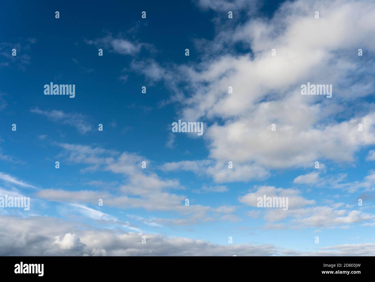 Alto cumulus clouds in deep blue sky Stock Photo