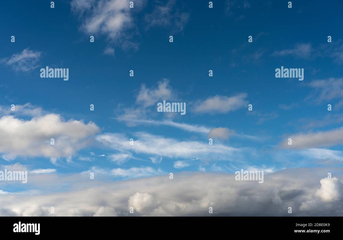 Alto cumulus clouds in deep blue sky Stock Photo
