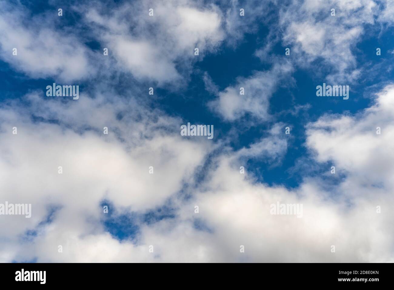 Alto cumulus clouds in deep blue sky Stock Photo