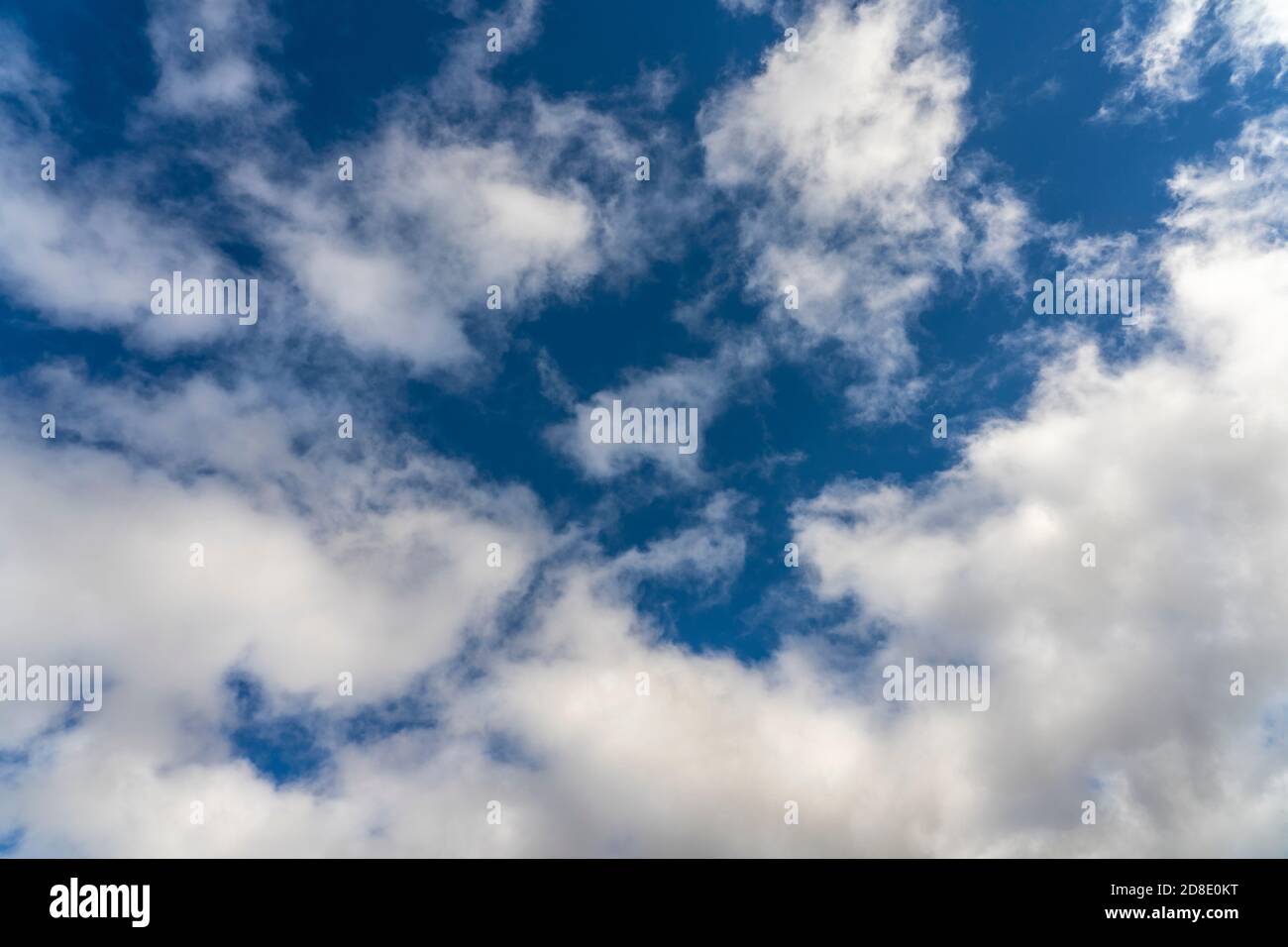 Alto cumulus clouds in deep blue sky Stock Photo