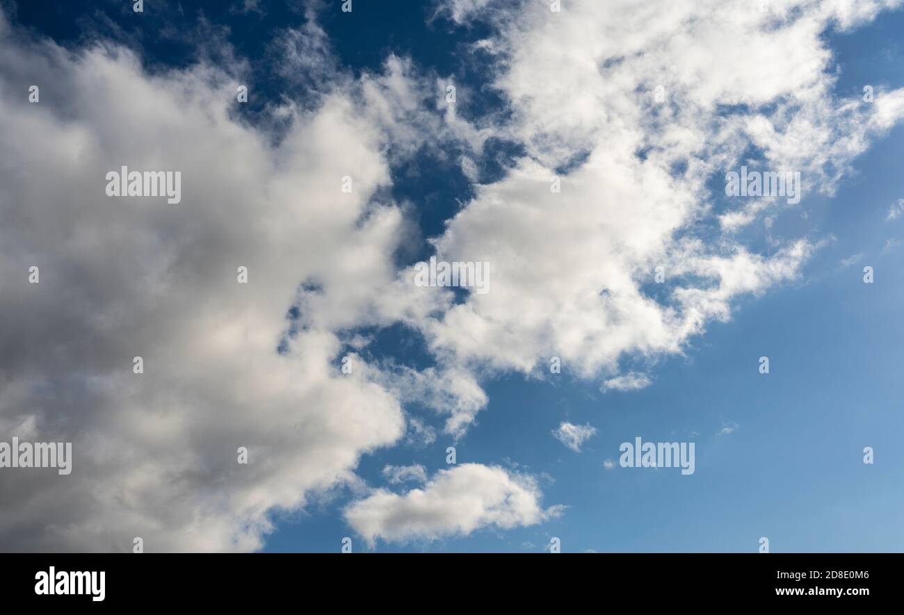 Alto cumulus clouds in deep blue sky Stock Photo