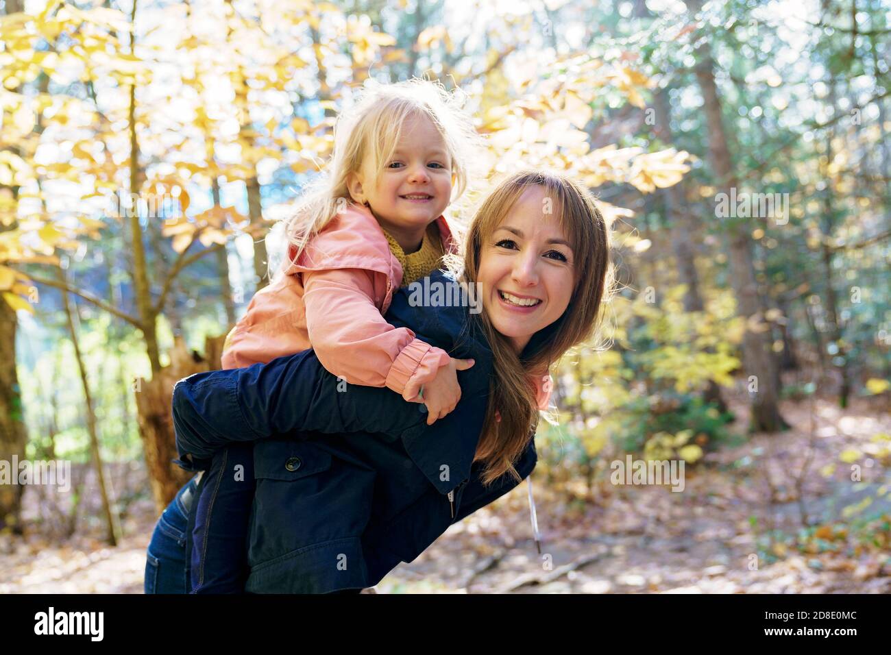 daughter and her mother in the autumn season in park Stock Photo - Alamy