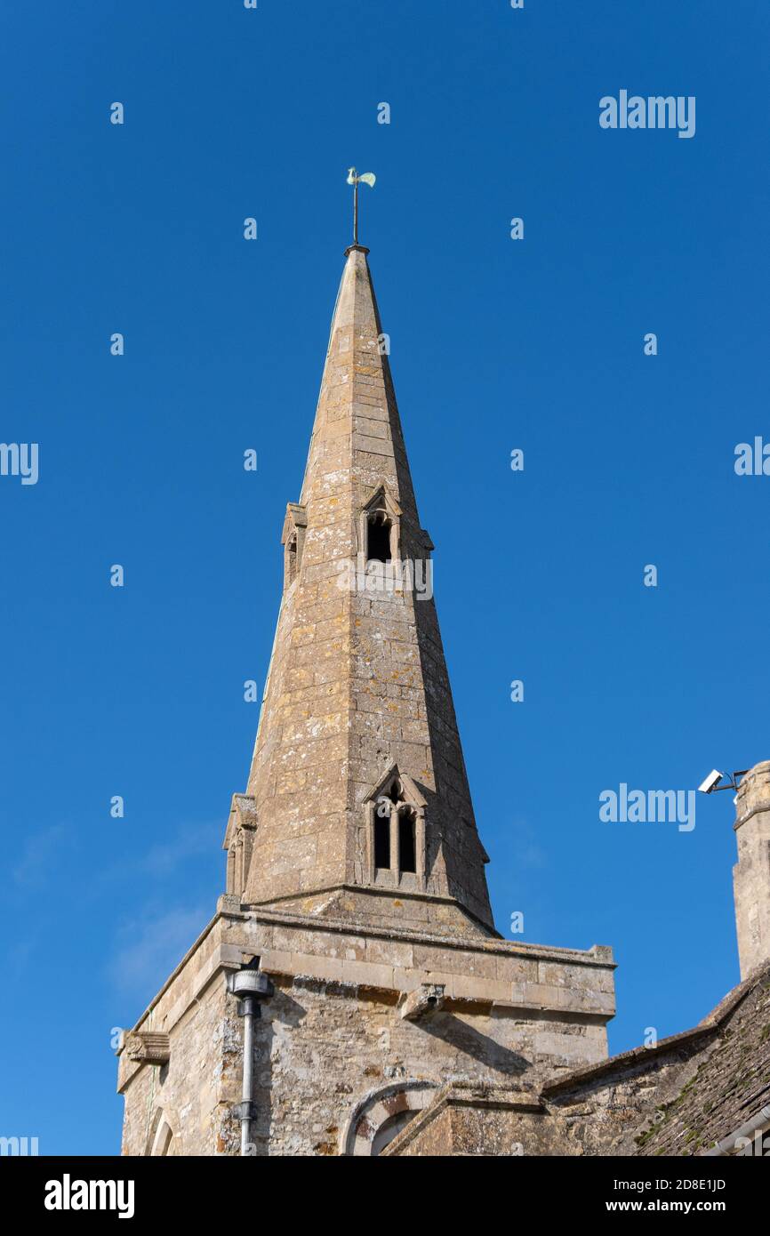 Spire of the church of St James in the village of Grafton Underwood, Northamptonshire, UK; it dates from 13th century Stock Photo