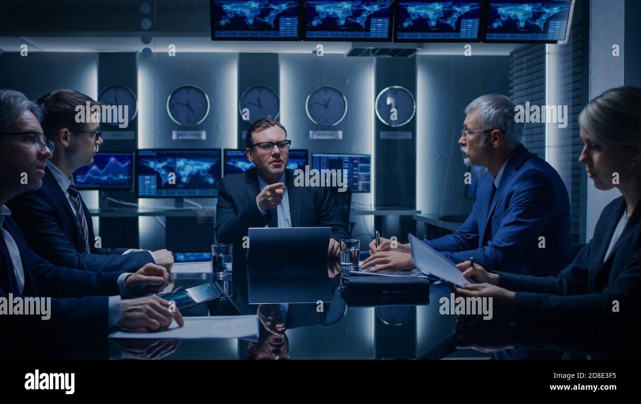 Corporate Executives Have a Closed Meeting With the Goverment Officials in the Negotiations Room. Serious Business People Solving Problems. Stock Photo