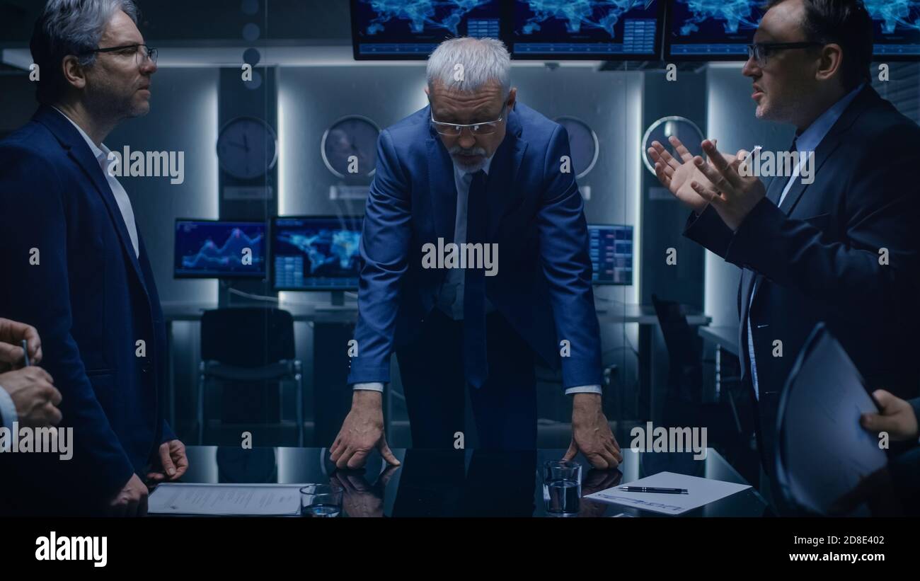 Team of Politicians, Government Officials, Corporate Business Leaders Have Heated Debate while Standing at the Negotiating Table in the Conference Stock Photo