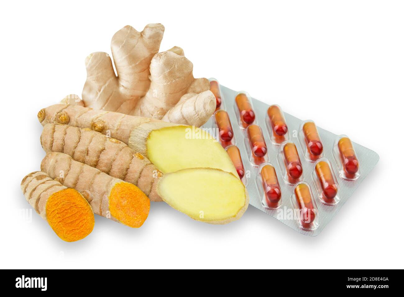 Curcuma and ginger roots capsules against white background Stock Photo