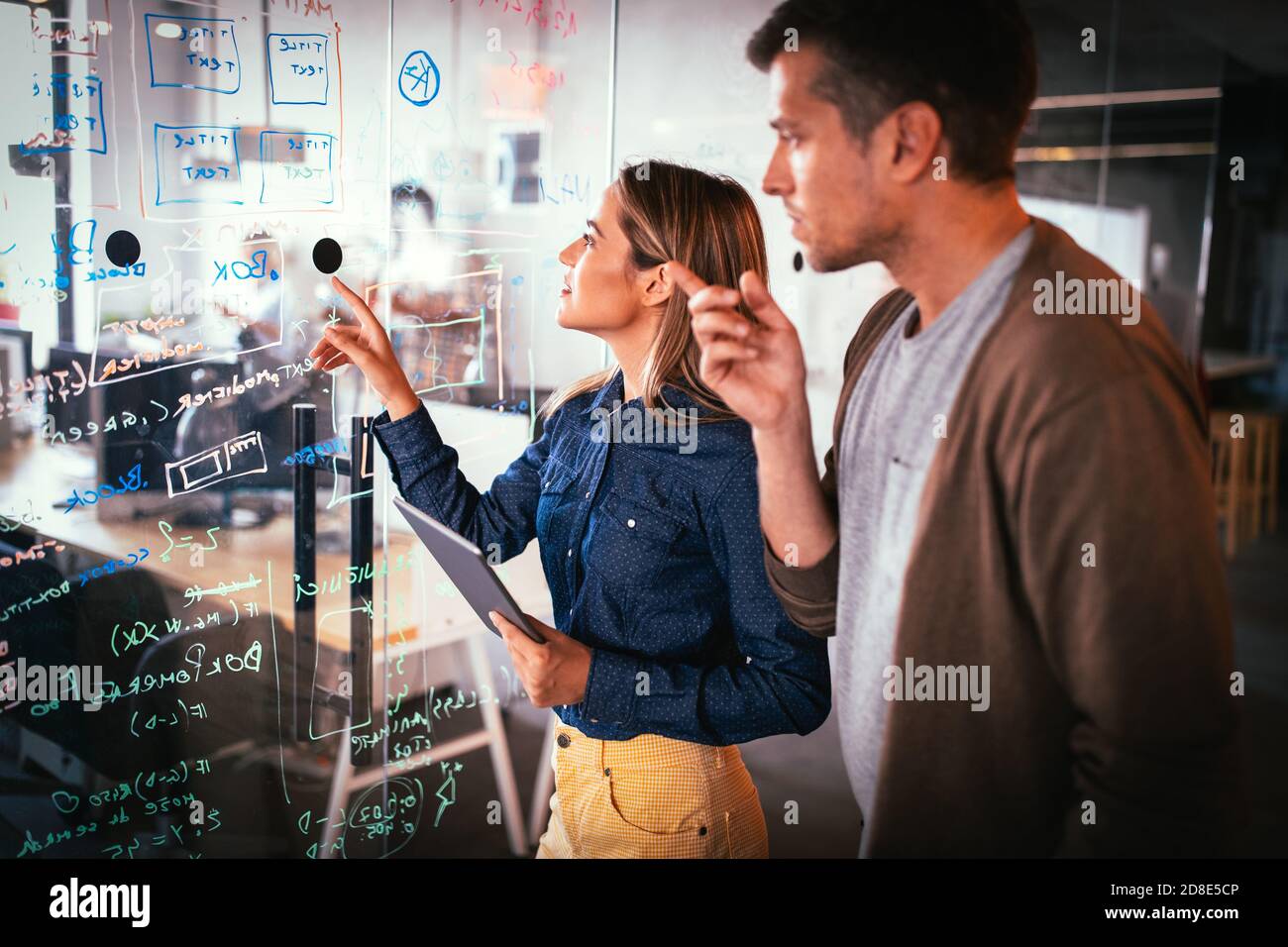Company employees working in software development and designer office Stock Photo