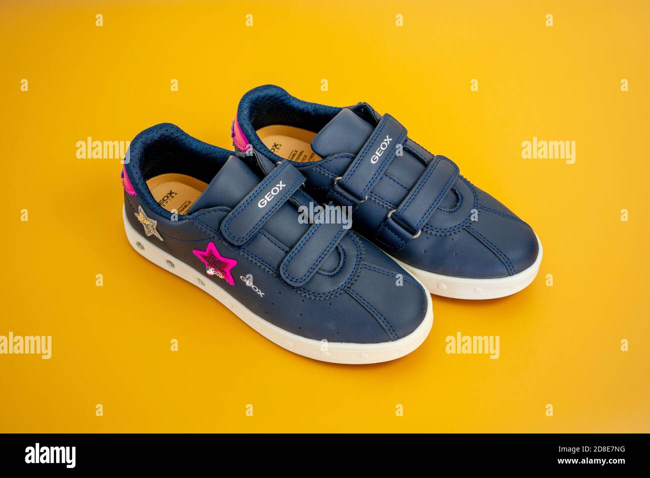 Nice, FRANCE 13.10.2020 Children's casual shoes GEOX on a beige background.  Decorated with shiny pink and silver stars. High quality photo Stock Photo  - Alamy