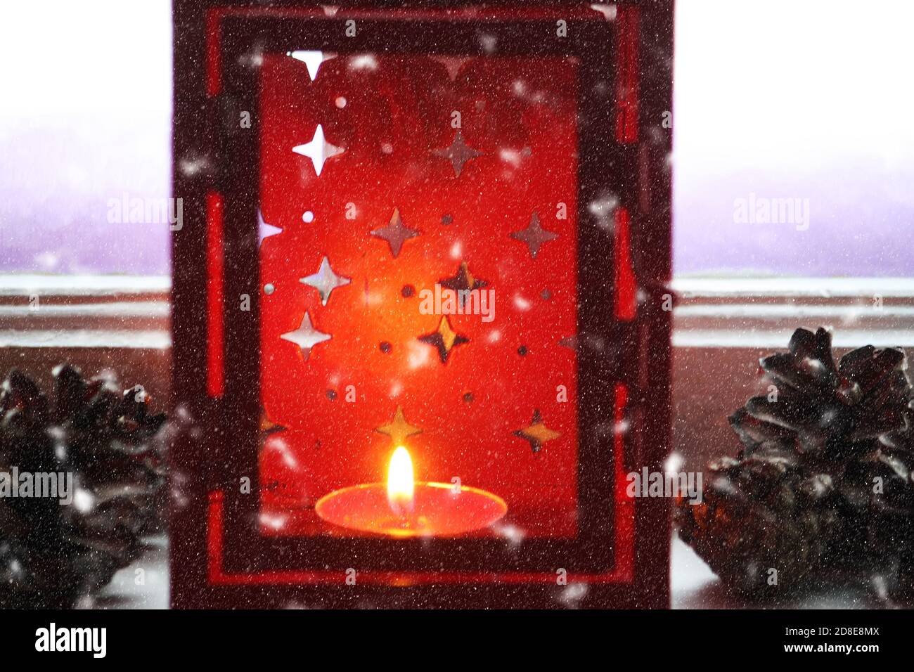 Decorative red christmas lantern with burning candle Stock Photo - Alamy