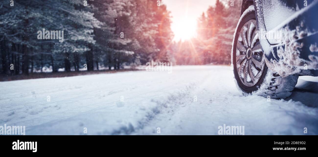Car tires on winter road covered with snow Stock Photo - Alamy