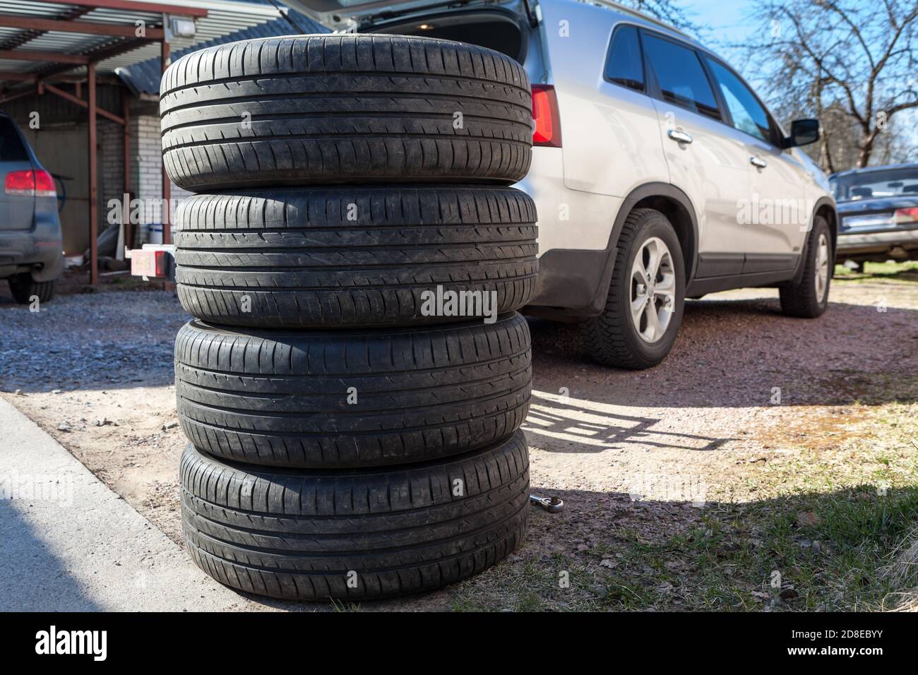 Used wheels with summer tires for suv car stacking on earth, seasonal
