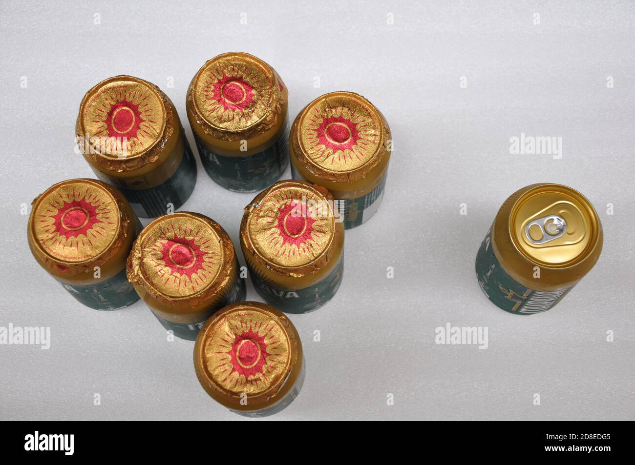 Beer cans, with mask, keeping social distance from beer without mask, security seal, top view, concept photo, white background, Brazil, South America Stock Photo