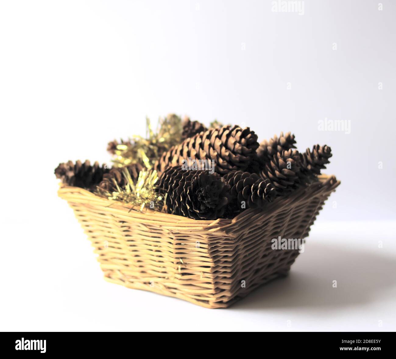 Fir-tree cones and christmas decorations in a small basket Stock Photo ...