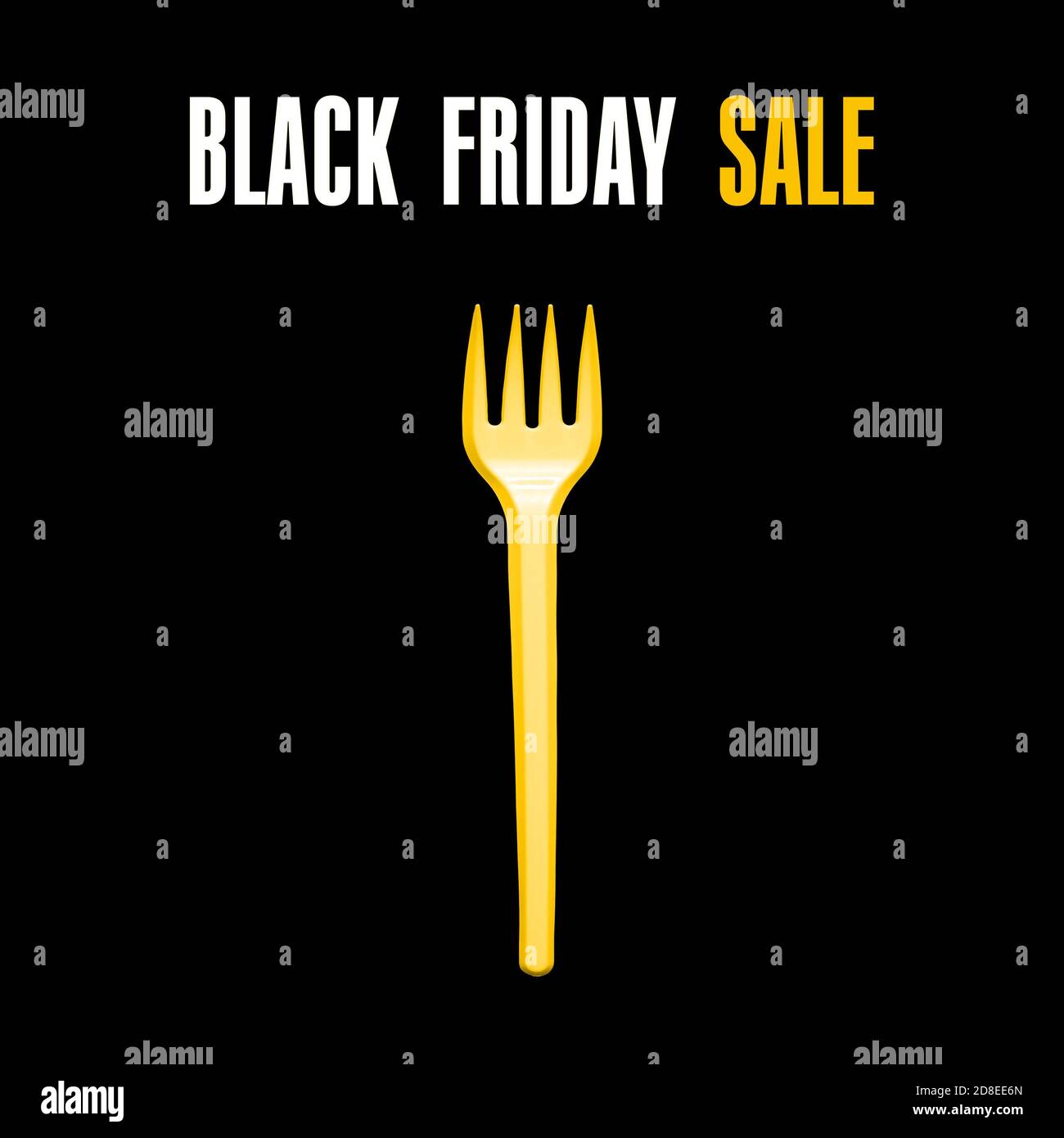 Yellow plastic fork on a black background. Black Friday concept Stock Photo