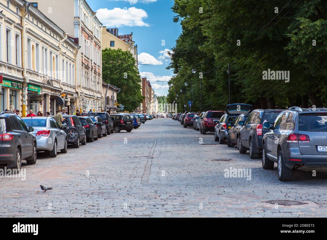 Vyborg, Russia-circa Jul, 2012: The Lenin avenue with cobblestone road and park area. The Vyborg is a town in western Russia, close to the Finnish bor Stock Photo
