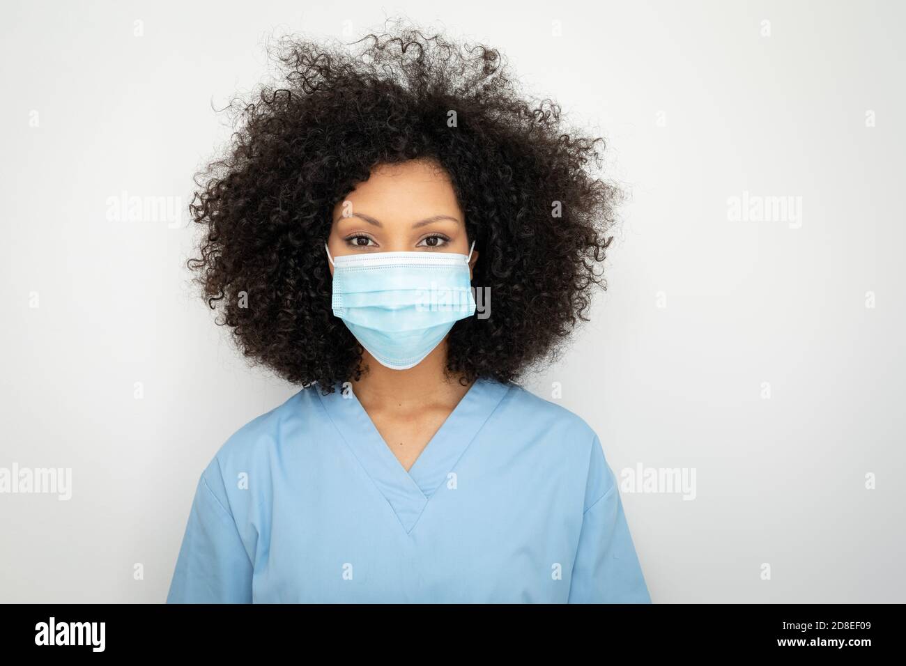 Portrait of female health worker wearing face mask Stock Photo - Alamy