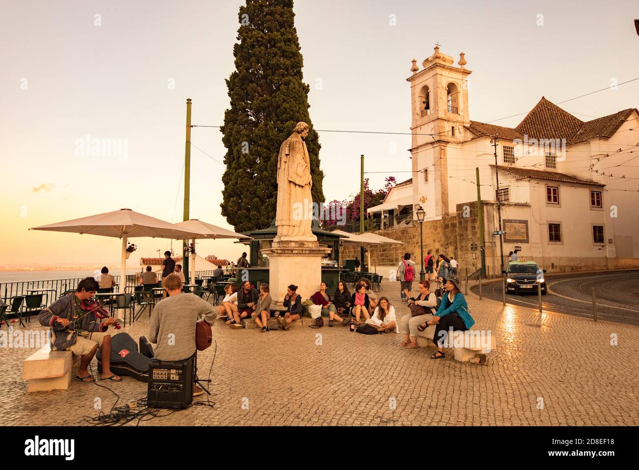 Public square with street musicians in front of the church of Santa Luzia in the Alfama neighborhood of Lisbon, Portugal, Europe. Stock Photo