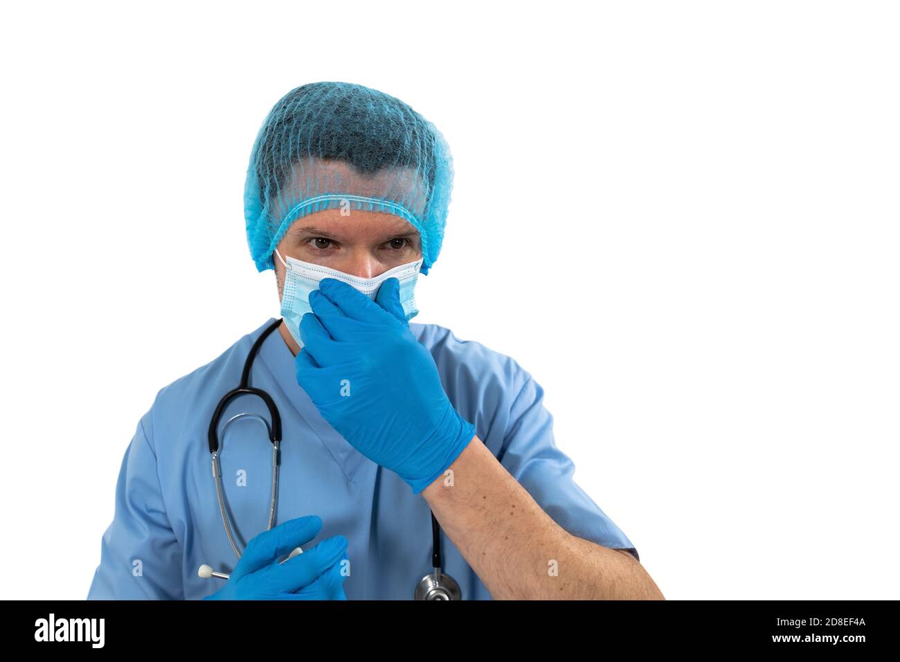 Male surgeon wearing face mask against white background Stock Photo - Alamy