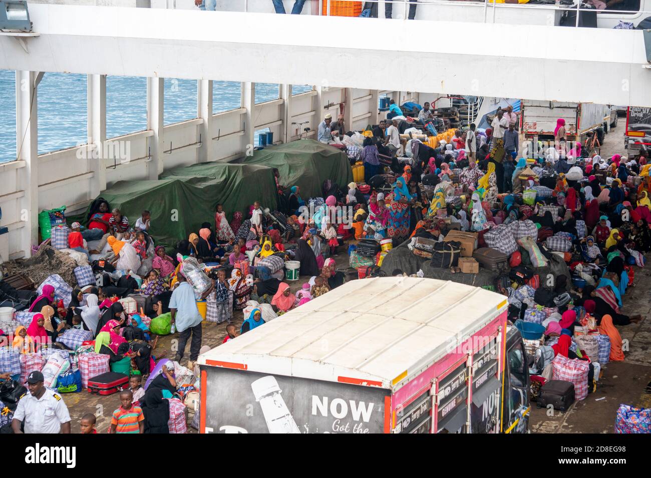 ZANZIBAR, TANZANIA - 5 JANUARY 2020: Ferry from Stone Town to Pemba island.  Unguja to Pemba, local transport vessel. Crowd of Local Black Muslim Stock  Photo - Alamy