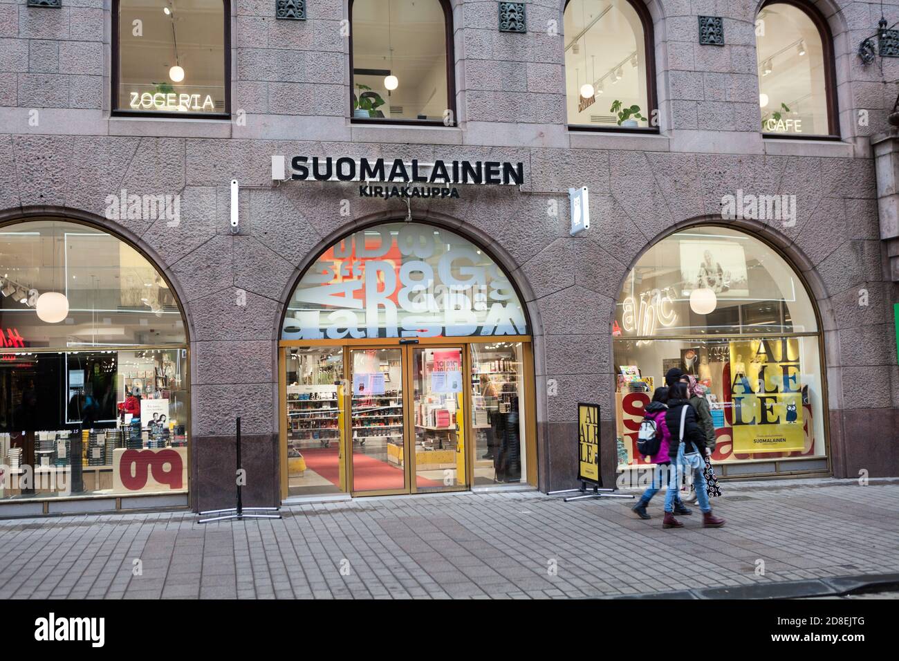 HELSINKI, FINLAND-CIRCA DEC, 2018: Entrance door in the Suomalainen Kirjakauppa shop. It is the largest bookshop chain and internet store in Finland. Stock Photo
