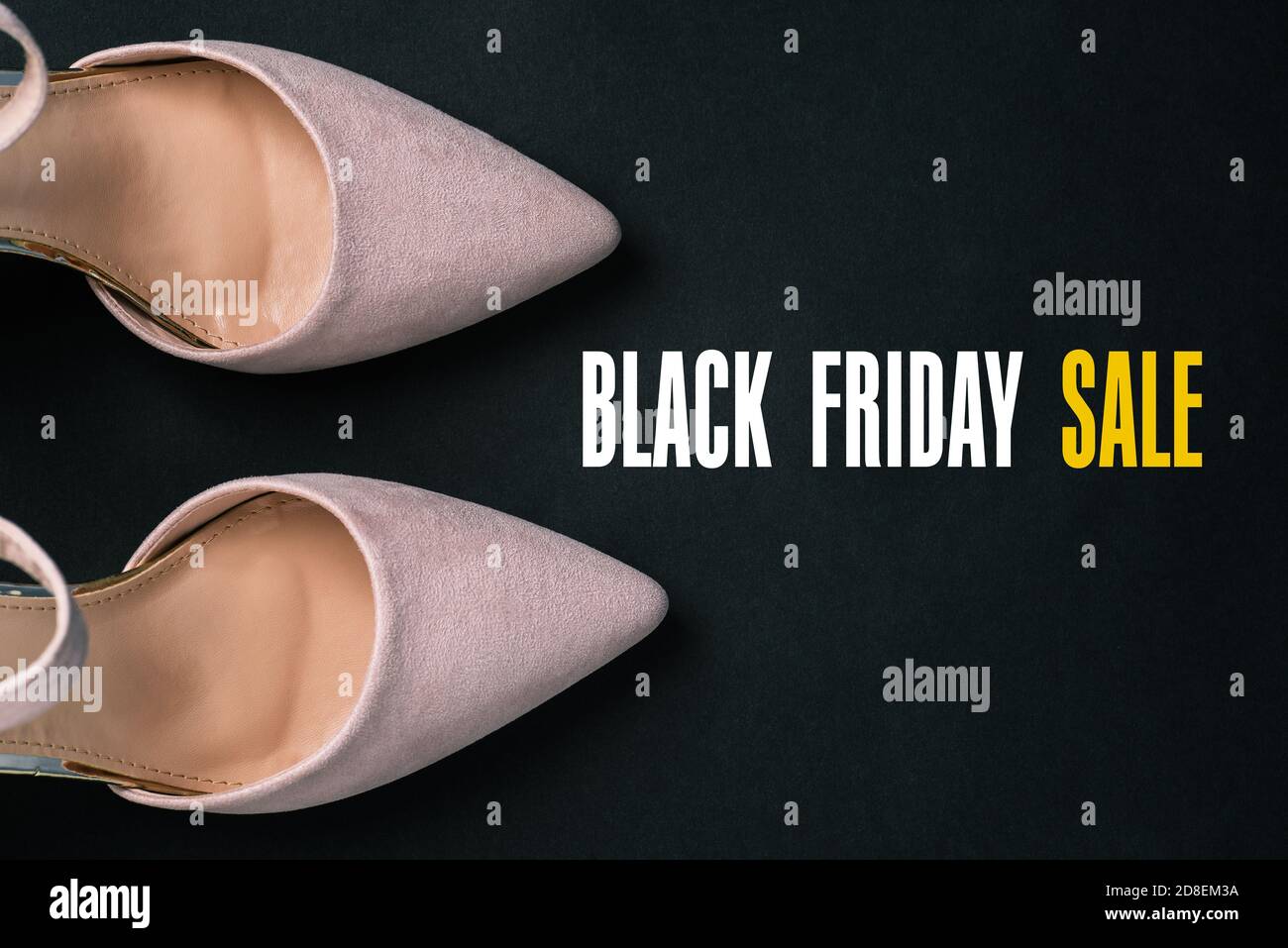 Beige shoes on a black background with a copy of the space. Womens shoes close-up. Womens blog. Flat layout. Stock Photo