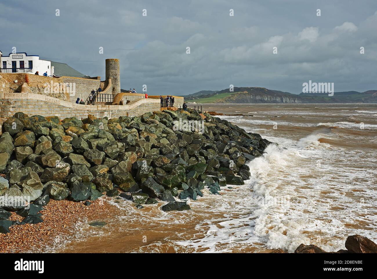 Rock armour sea defences protect the town of Lyme Regis from the intensity of the English Channel Stock Photo