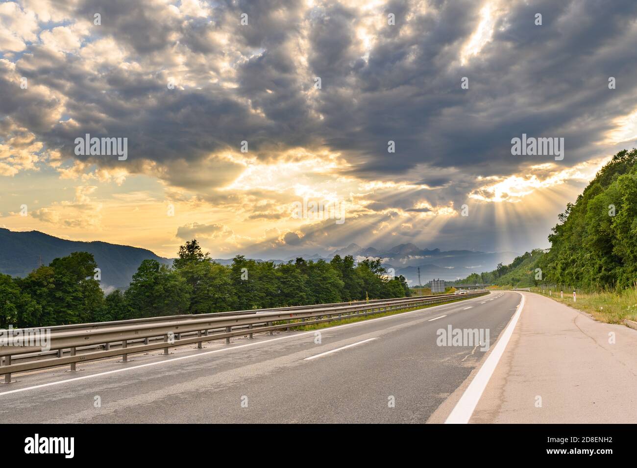 Sinuous Road in Summer Day, sunset scenery Stock Photo