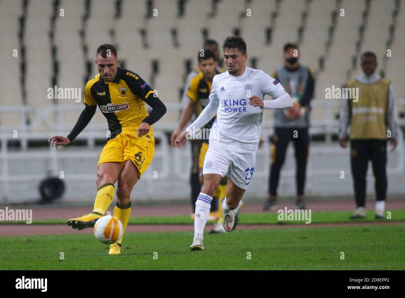 ATHENS, GREECE - OCTOBER 29: Nenad Krstičić of AEK Athens attacks in front  of Cengiz Ünder of Leicester City during the UEFA Europa League Group G  stage match between AEK Athens and