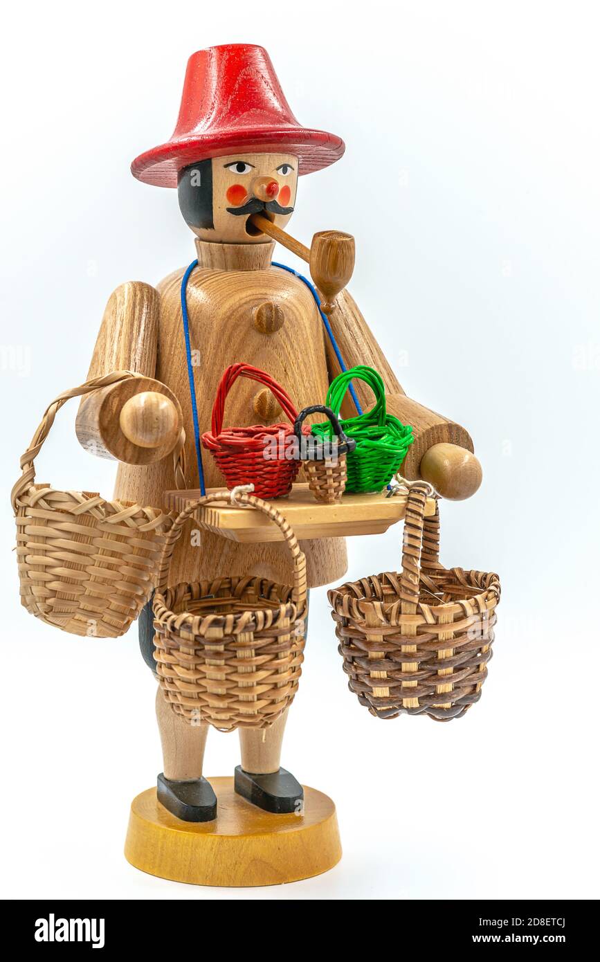 Closeup of a original handcarved wooden German Christmas Smoking Man figurine on a white background Stock Photo