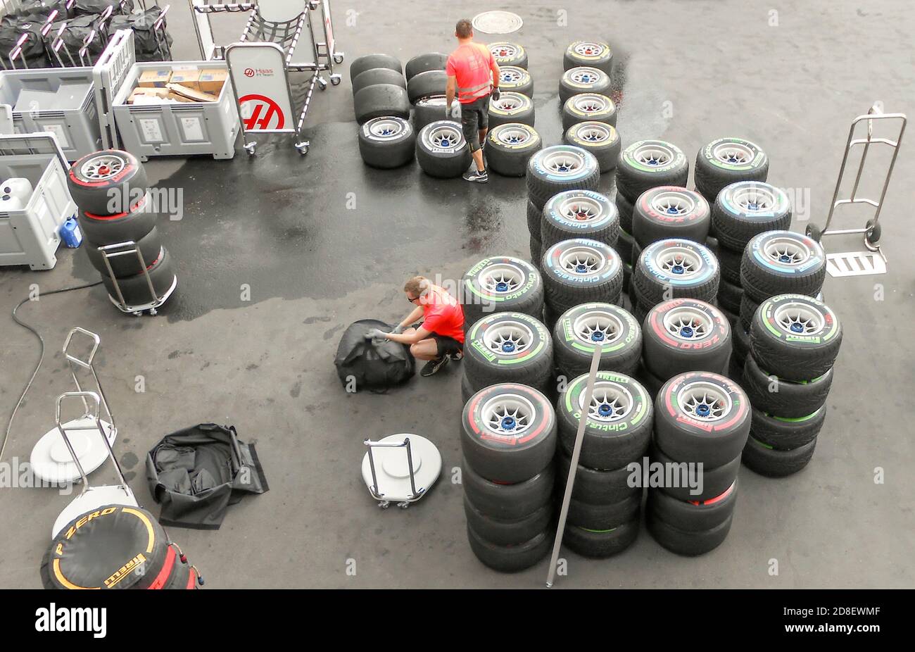 Support team prepares tyres before a Formula One Race Stock Photo